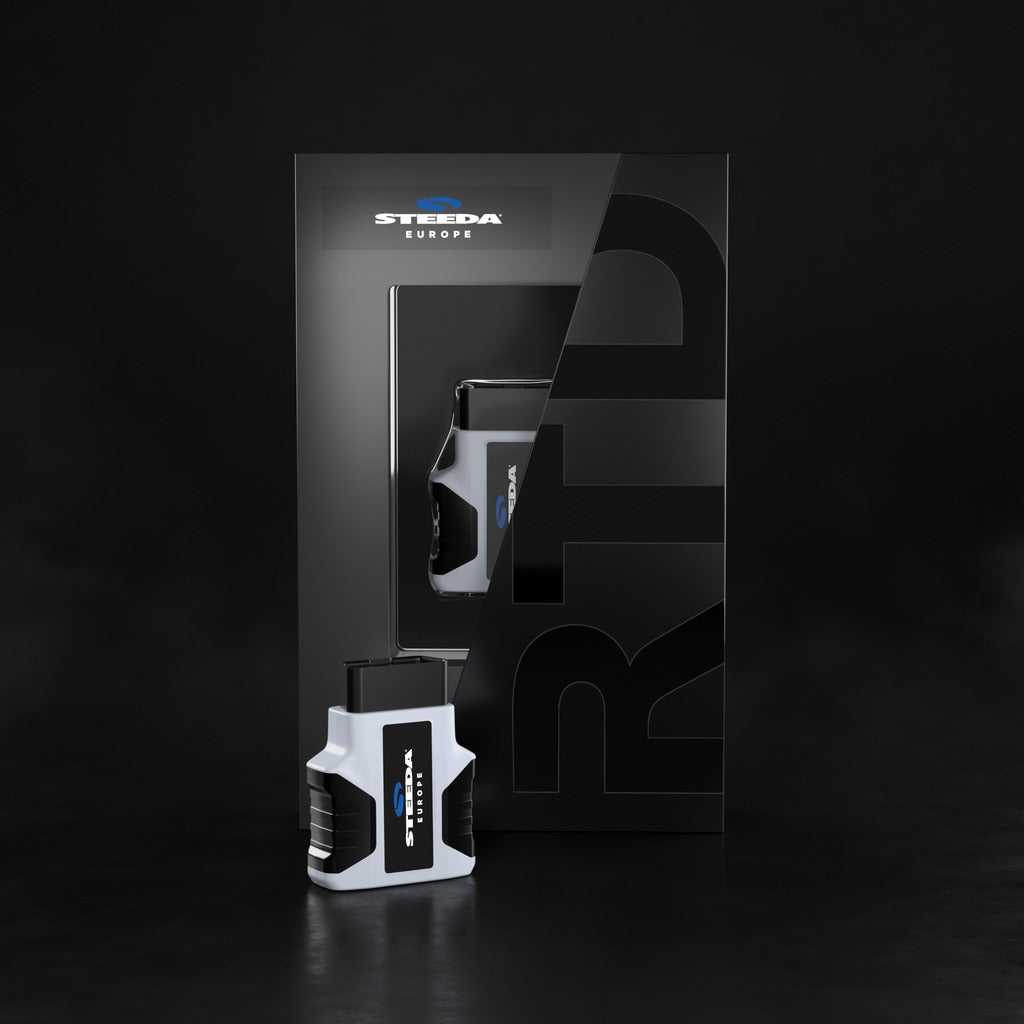 Steeda HP Tuners RTD (remote tuning Device) OBD2 device with packaging on a dark background