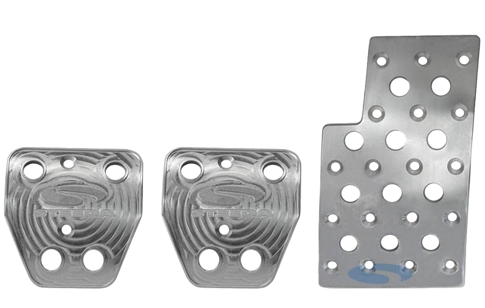 A set of three metal pedals designed for use in a Mustang, featuring two round pedals and one rectangular pedal with multiple holes, branded with the Steeda logo.